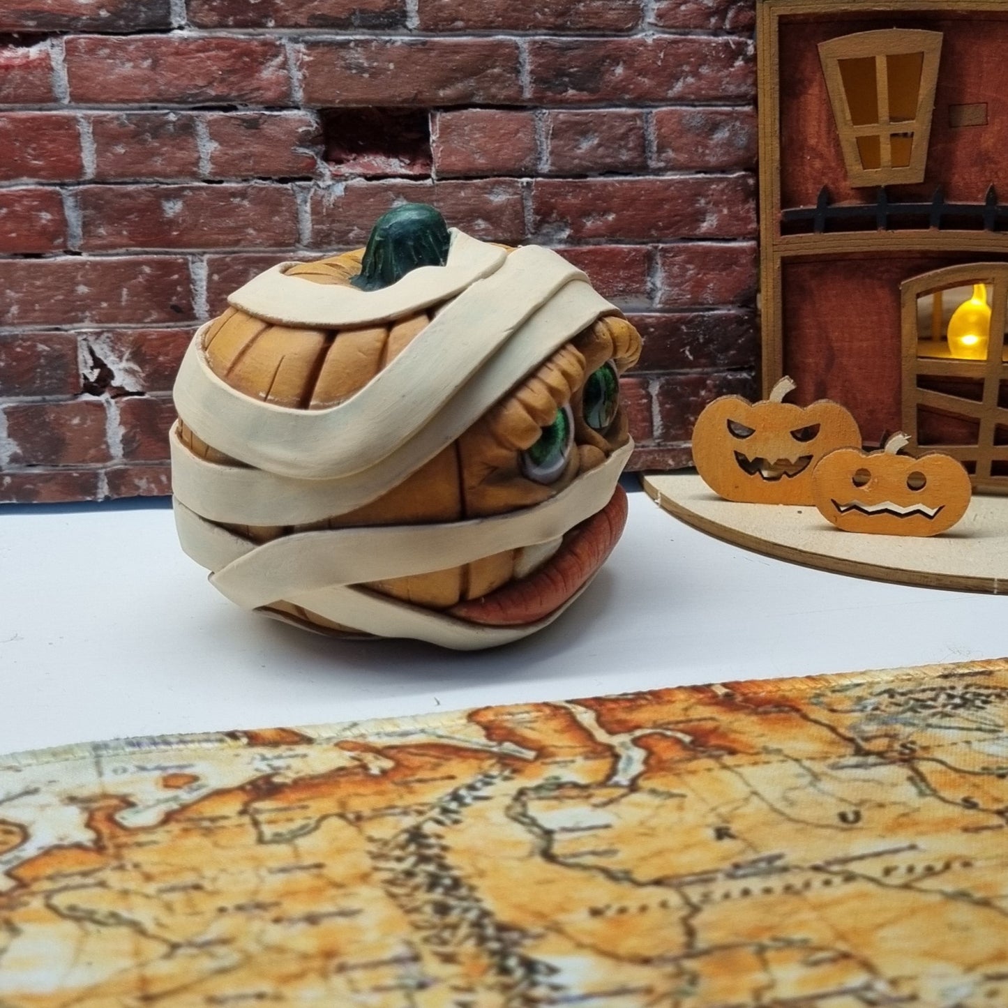 Handmade Mummy Pumpkin Decoration – Polymer Clay Halloween Figurine with Green Cabochon Eyes